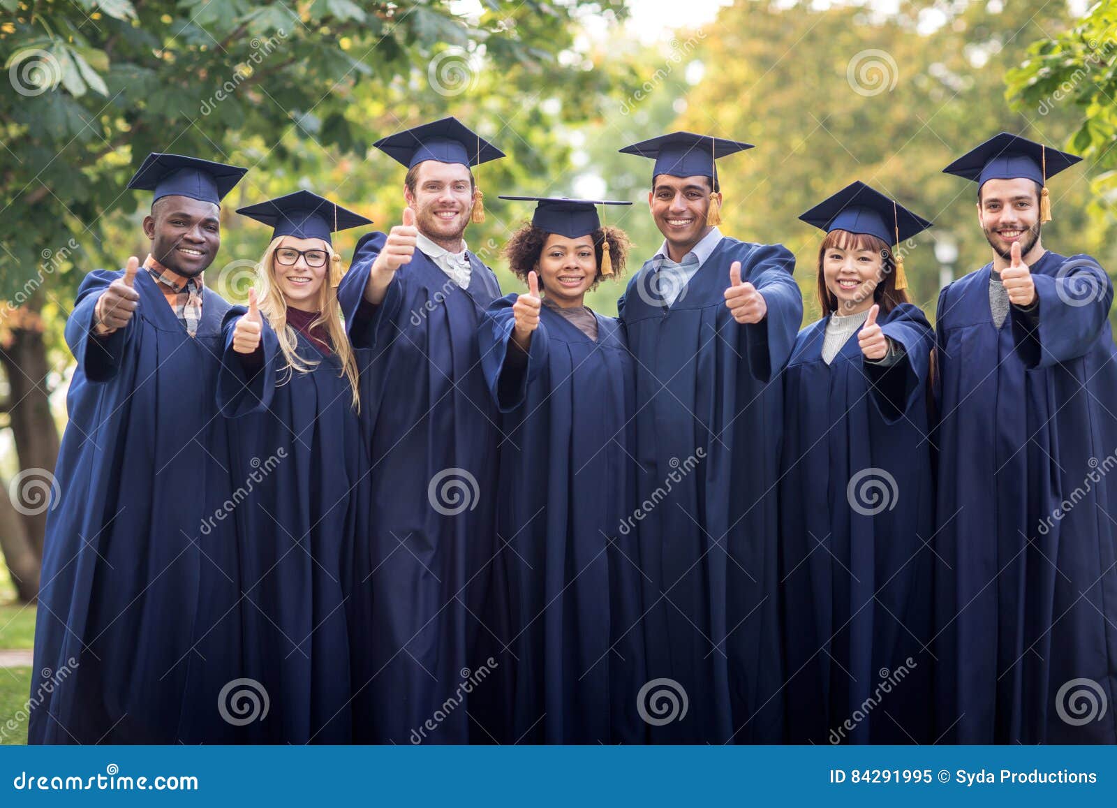 Happy Students or Bachelors Showing Thumbs Up Stock Image - Image of ...