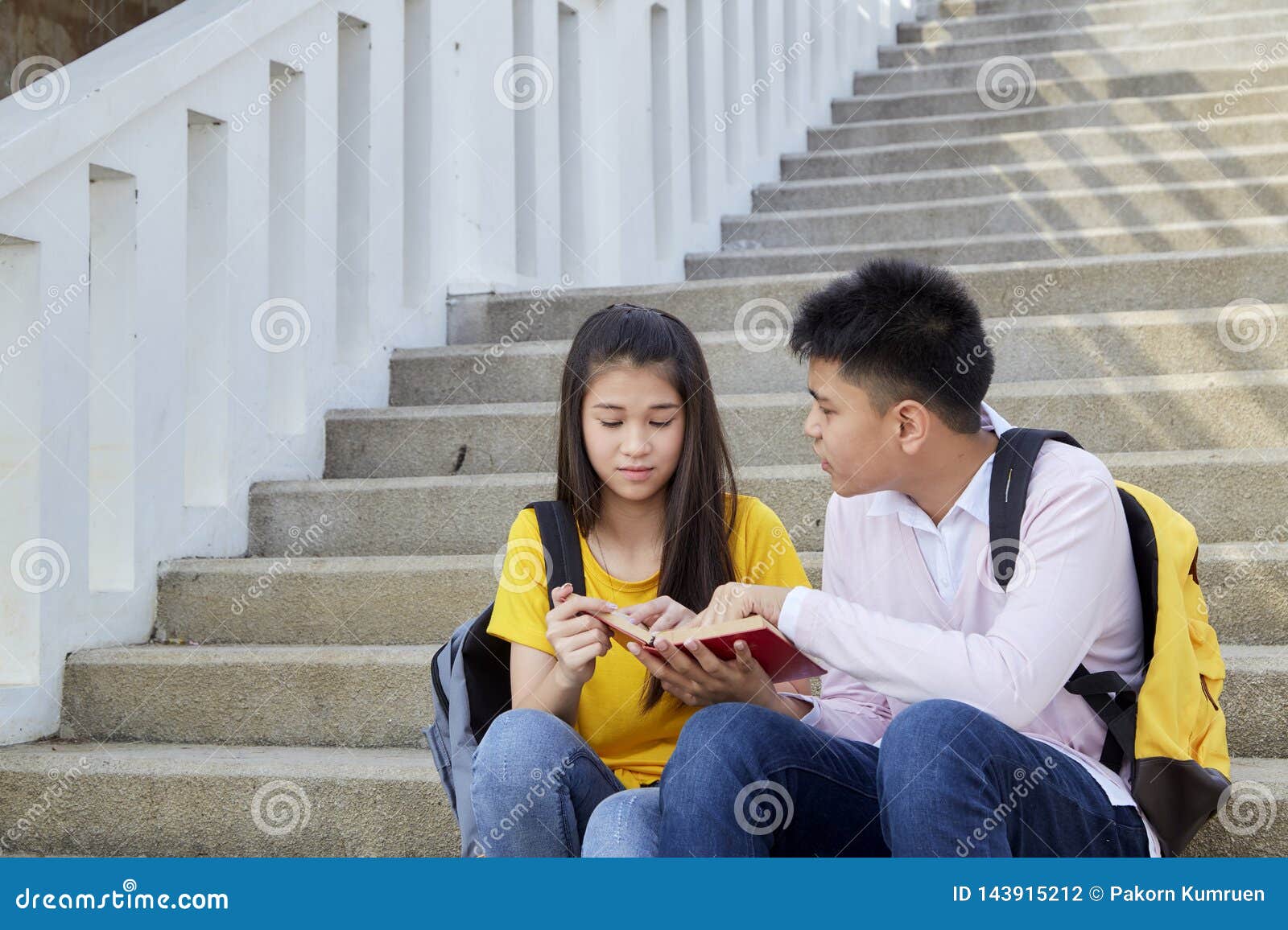 Happy Students Outdoor with Books Stock Photo - Image of holding ...