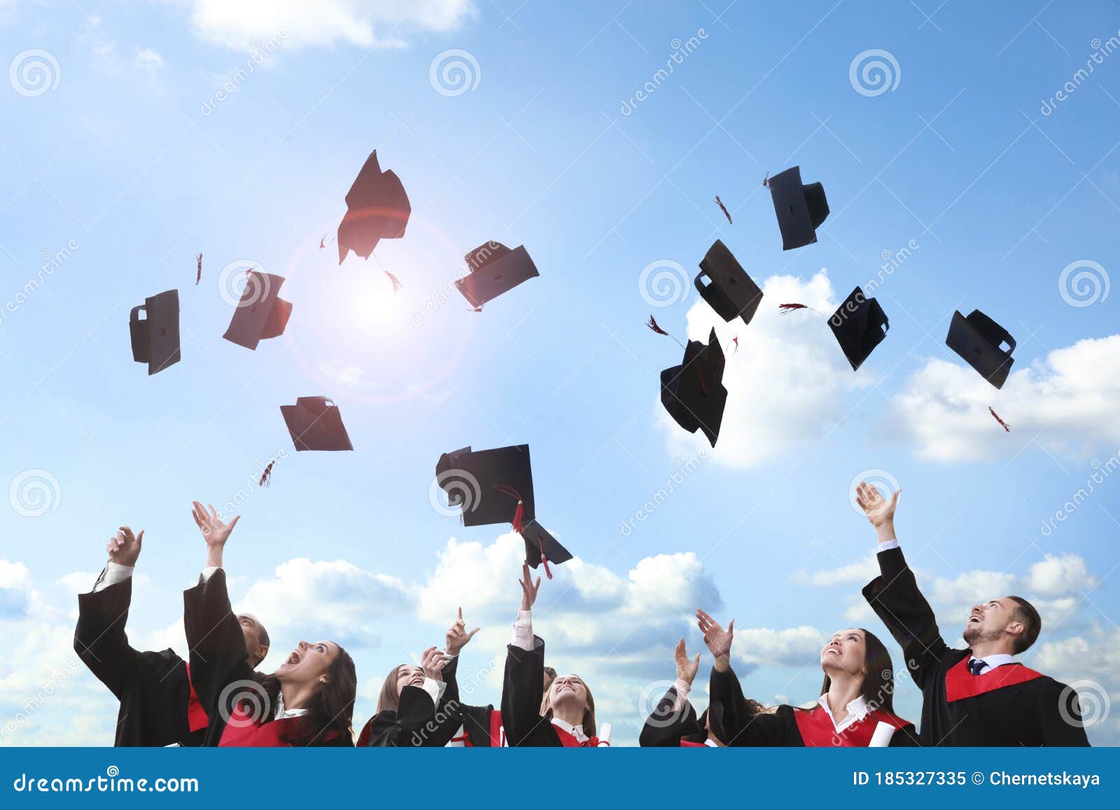 Happy Students Throwing Graduation Hats In Air Stock Image Image Of