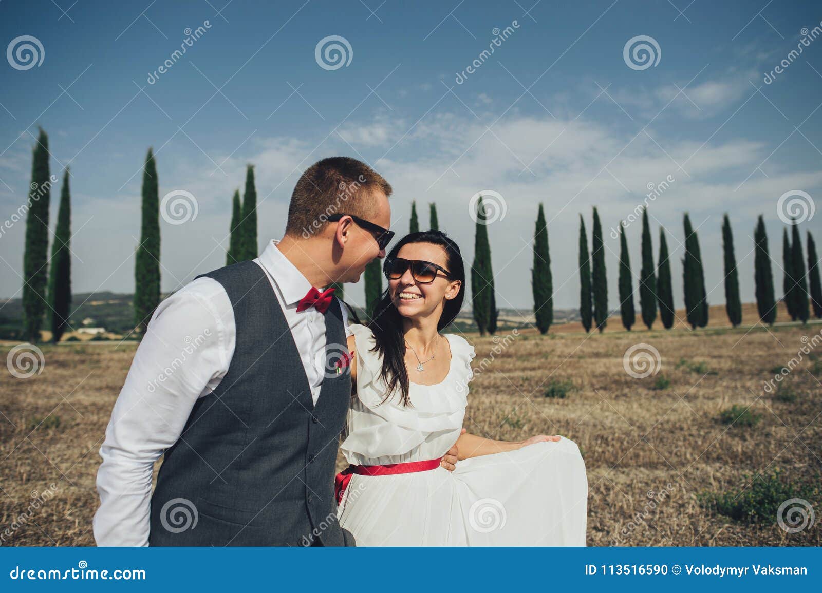 Happy Stylish Smiling Couple Walking And Kissing In Tuscany Ita Stock