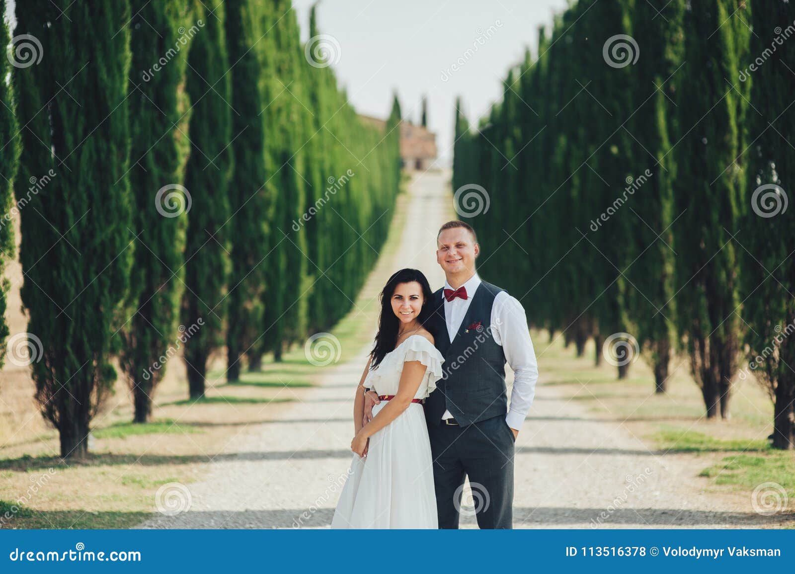 Happy Stylish Smiling Couple Walking And Kissing In Tuscany Ita Stock