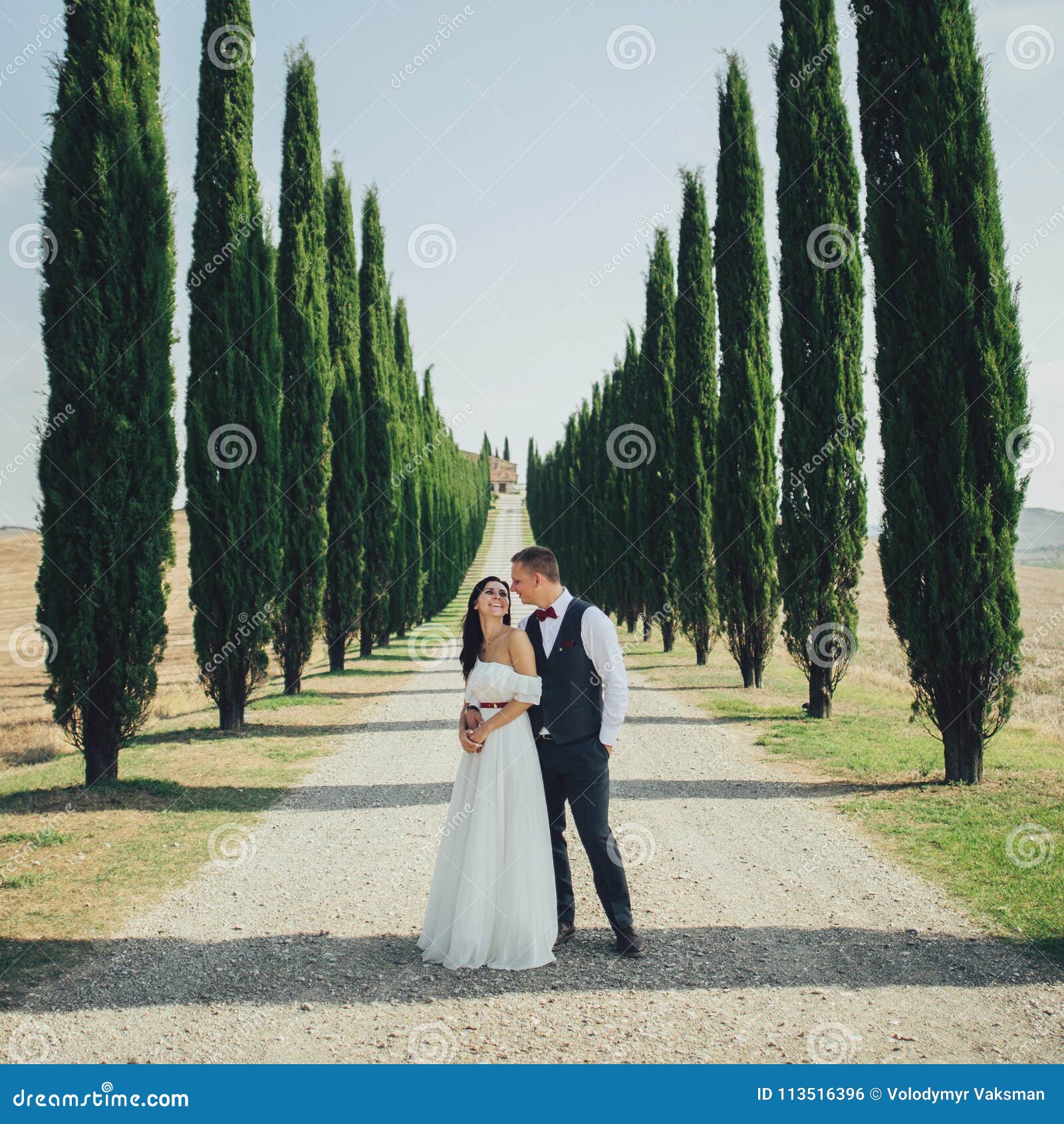 Happy Stylish Smiling Couple Walking And Kissing In Tuscany Ita Stock