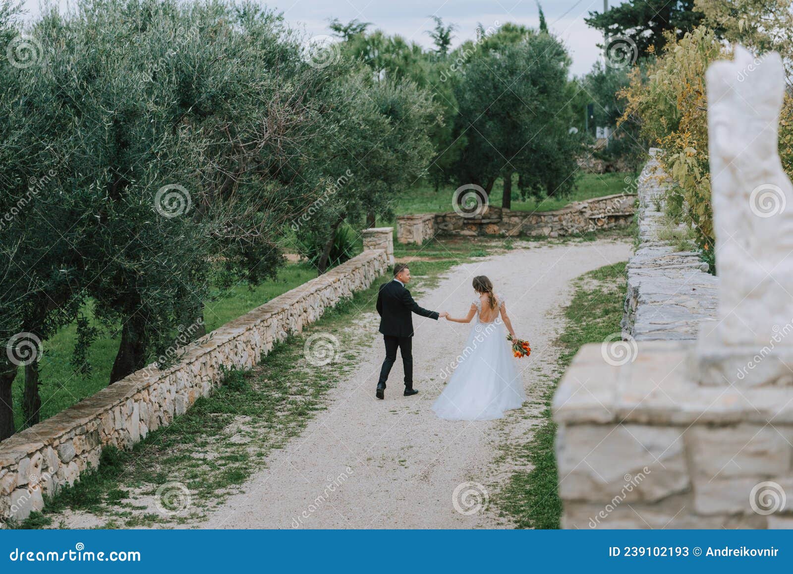 Happy Stylish Smiling Couple Walking In Tuscany Italy On Their Wedding