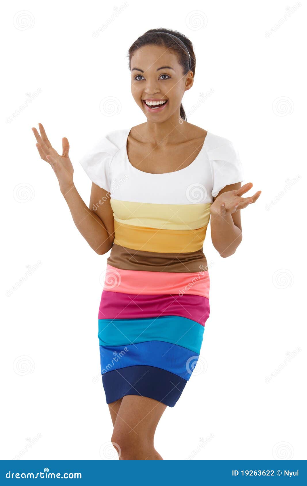 happy surprised girl in multicolour dress