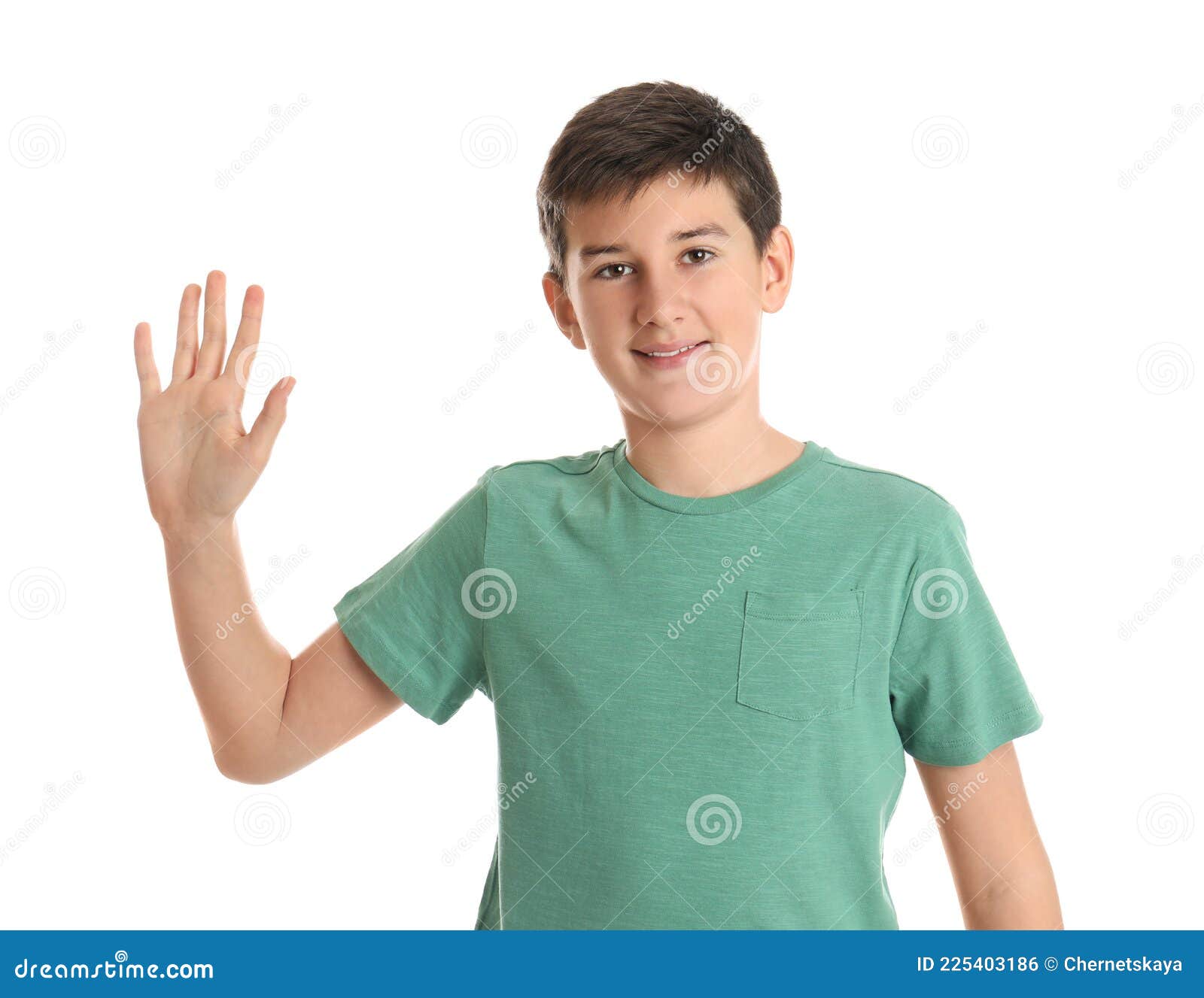 happy teenage boy waving to say hello on white