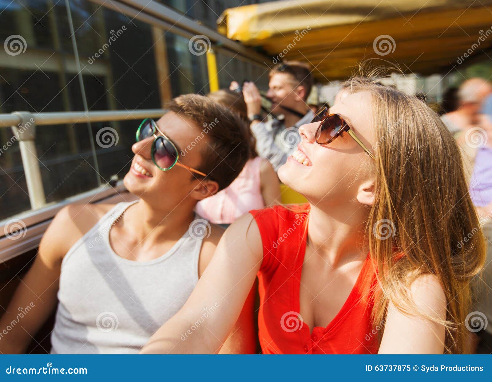 Happy Teenage Couple Traveling By Tour Bus Stock Image