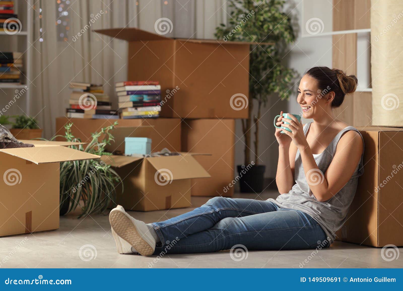 happy tenant resting drinking coffee moving home
