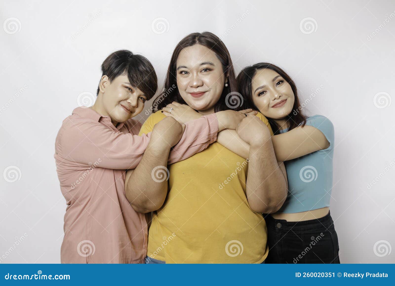 Happy Three Close Friends Hugging Each Other Showing Friendly Gesture