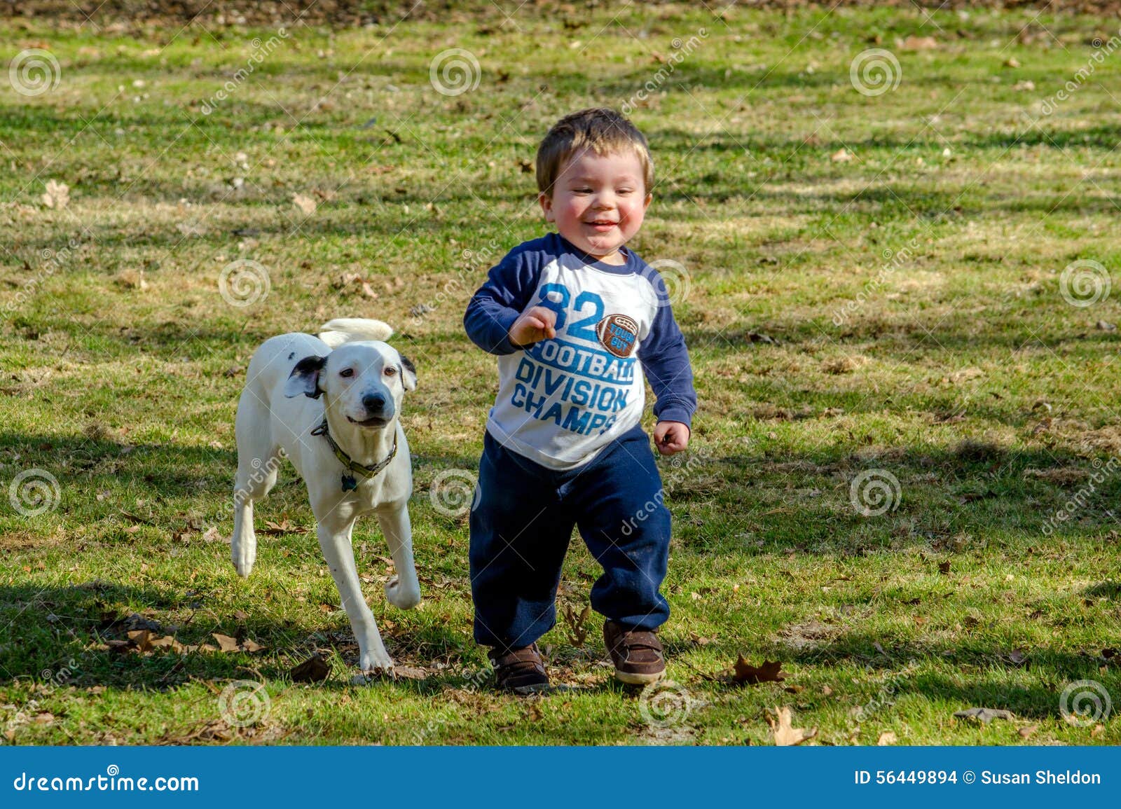 Happy toddler with dog stock photo. Image of little, toddler 56449894