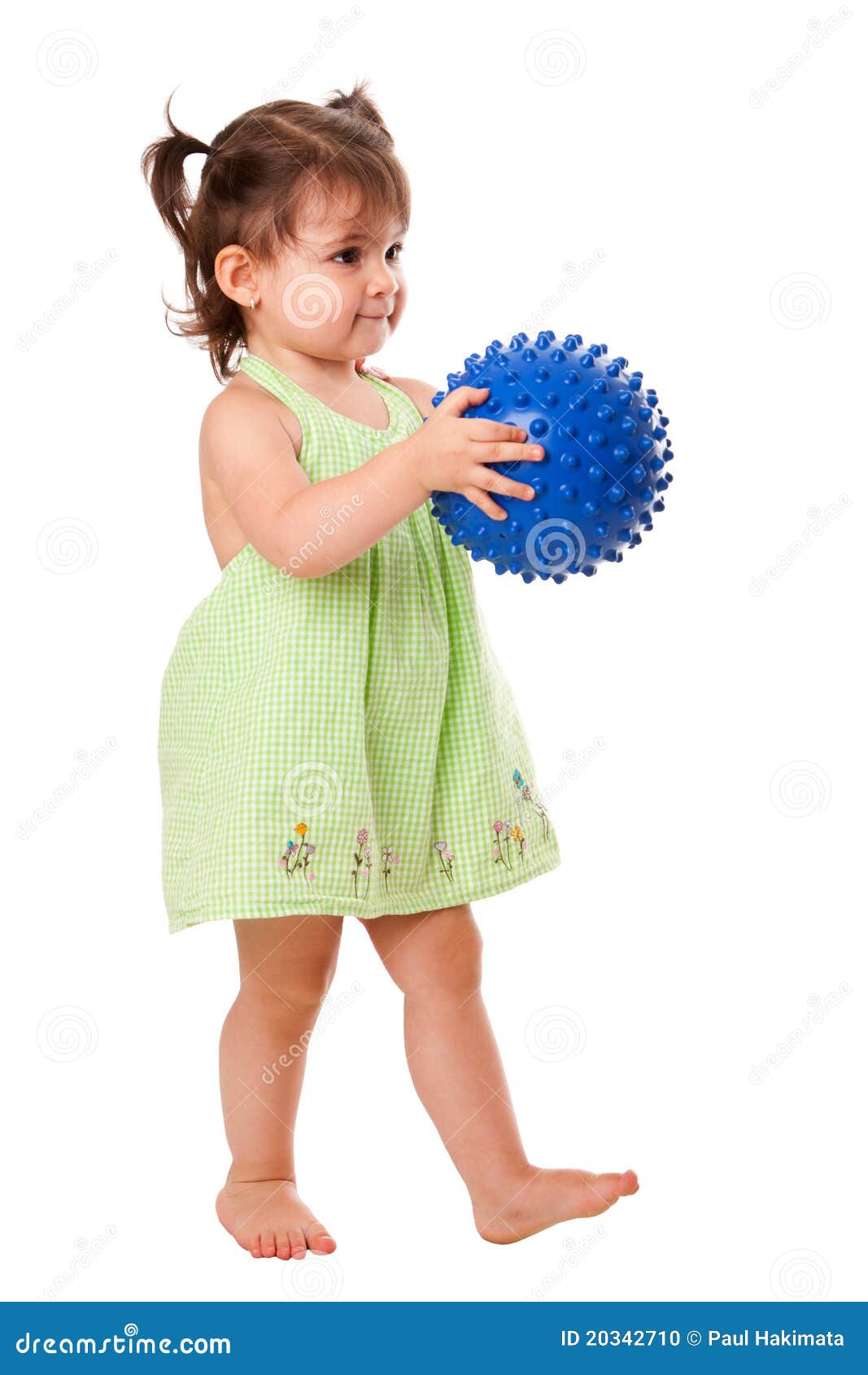 happy toddler girl with ball