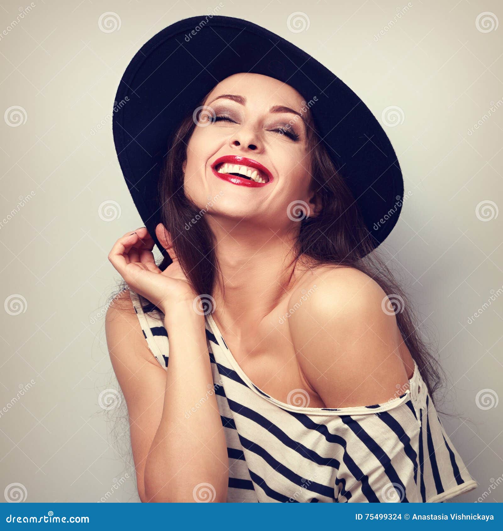 Happy Toothy Laughing Brunette Young Woman in Black Hat with Closed ...