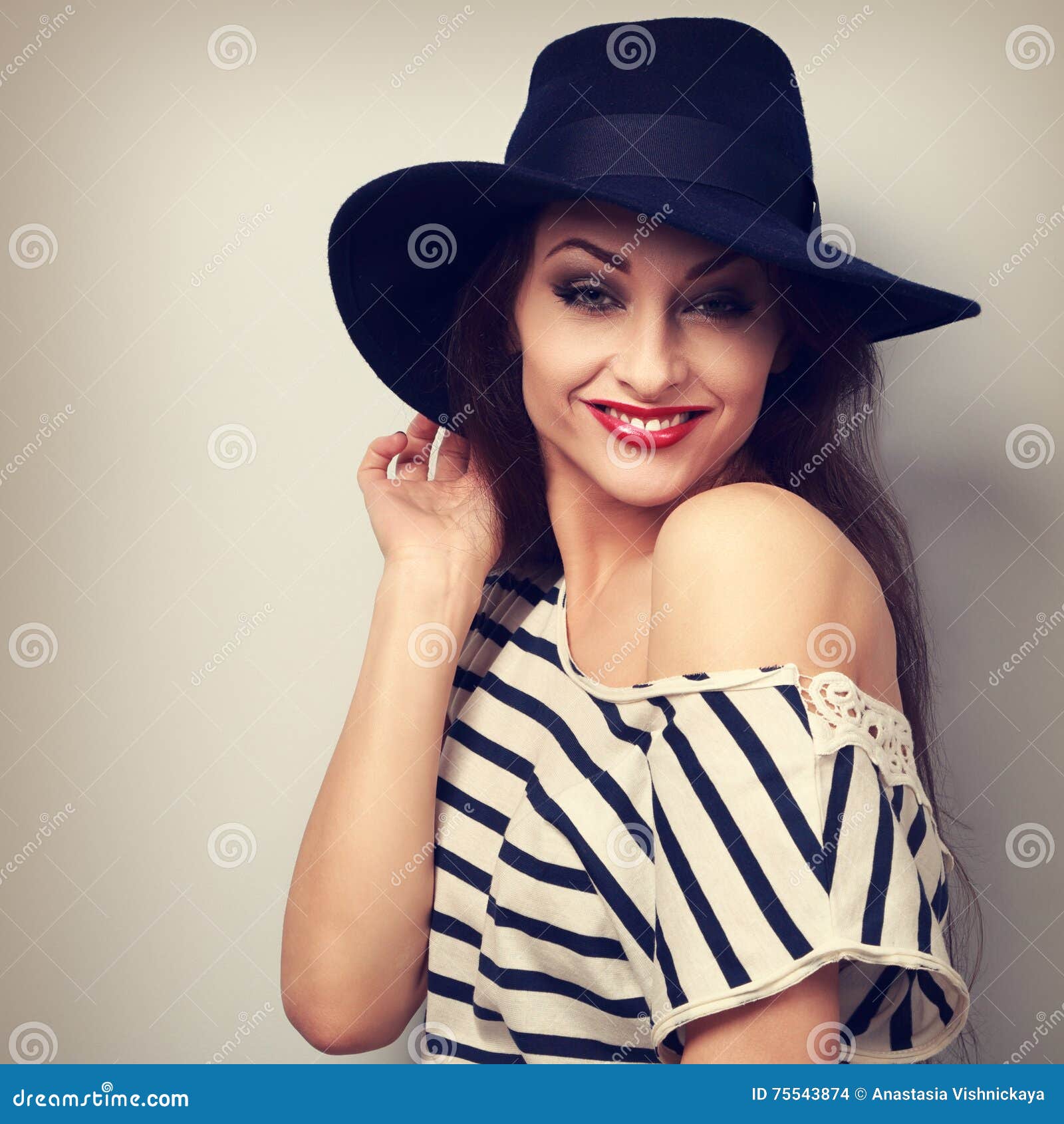 Happy Toothy Smiling Makeup Female Model in Black Hat with Red L Stock ...