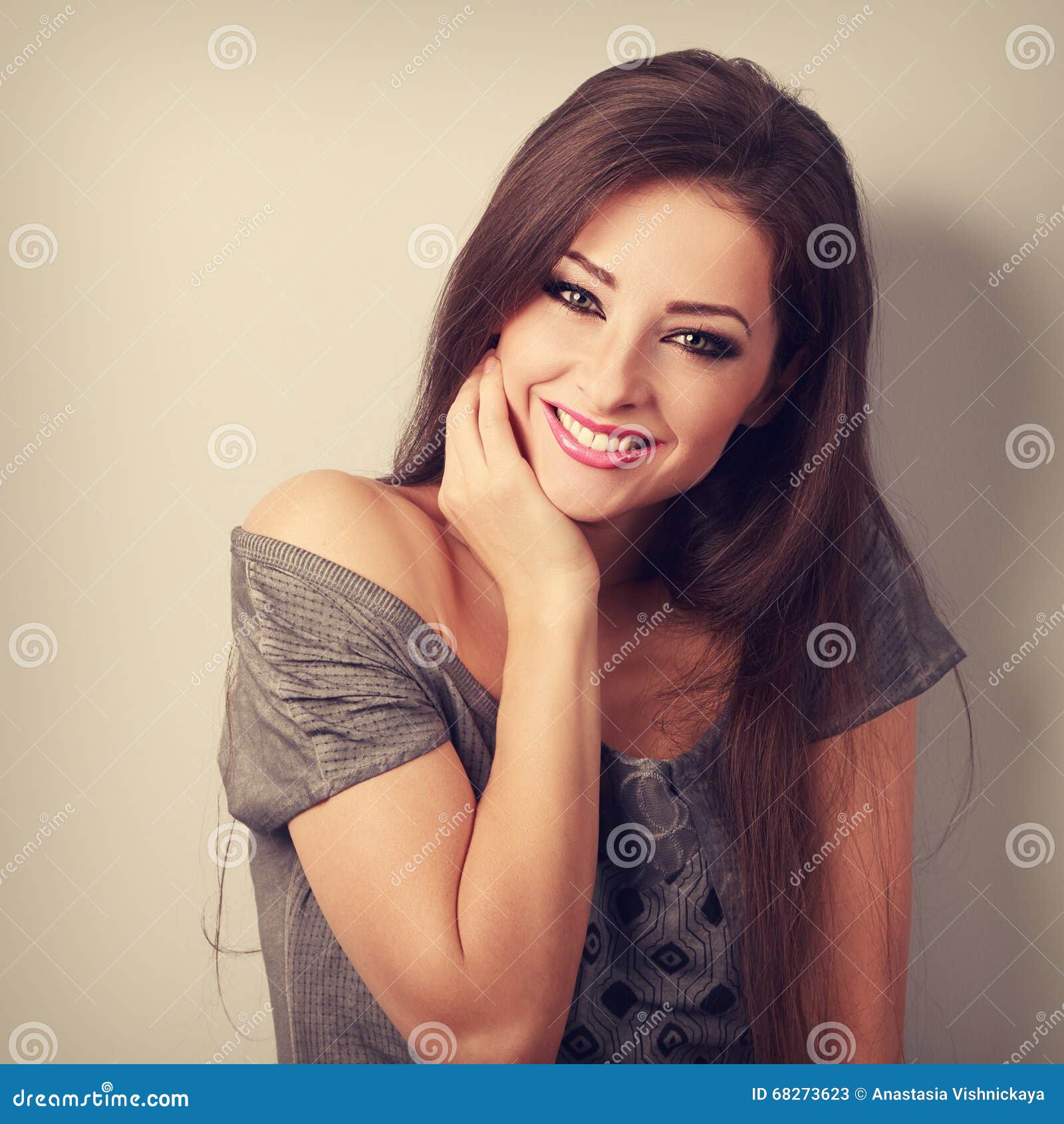 happy toothy smiling young woman with long hair in fashion blouse. coseup vintage toned portrait