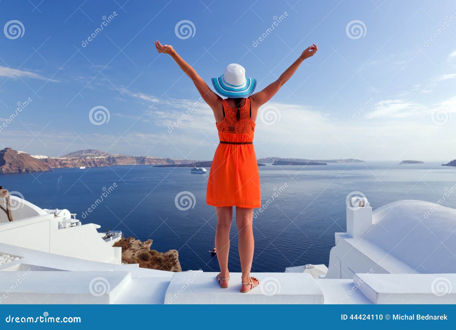 happy tourist woman on santorini island, greece. travel