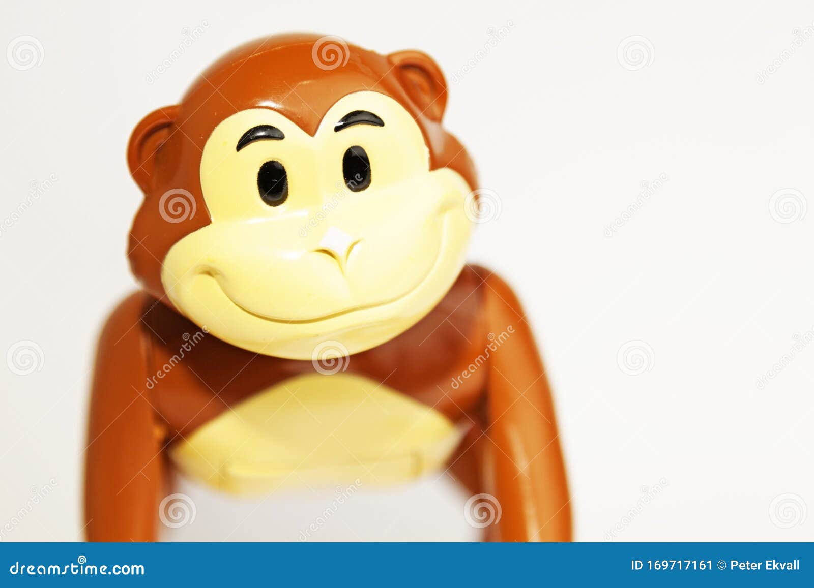 Happy Toy Monkey In Plastic On White Background Stock Image Image of