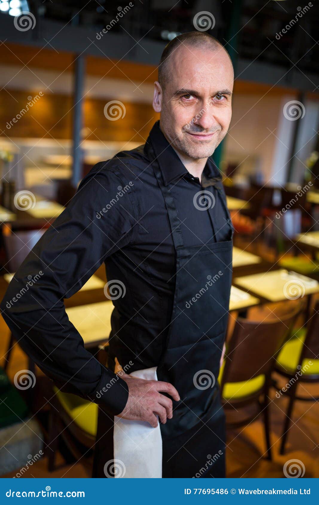 Happy Waiter Carrying Serving Tray With Champagne Flutes RoyaltyFree