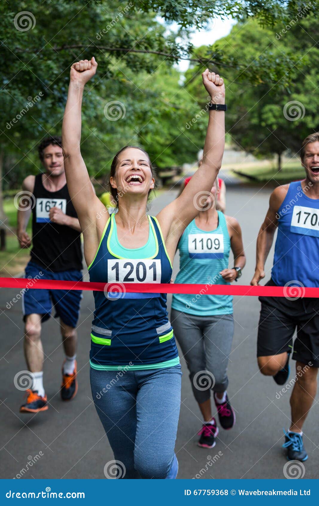 happy woman crossing the finish line
