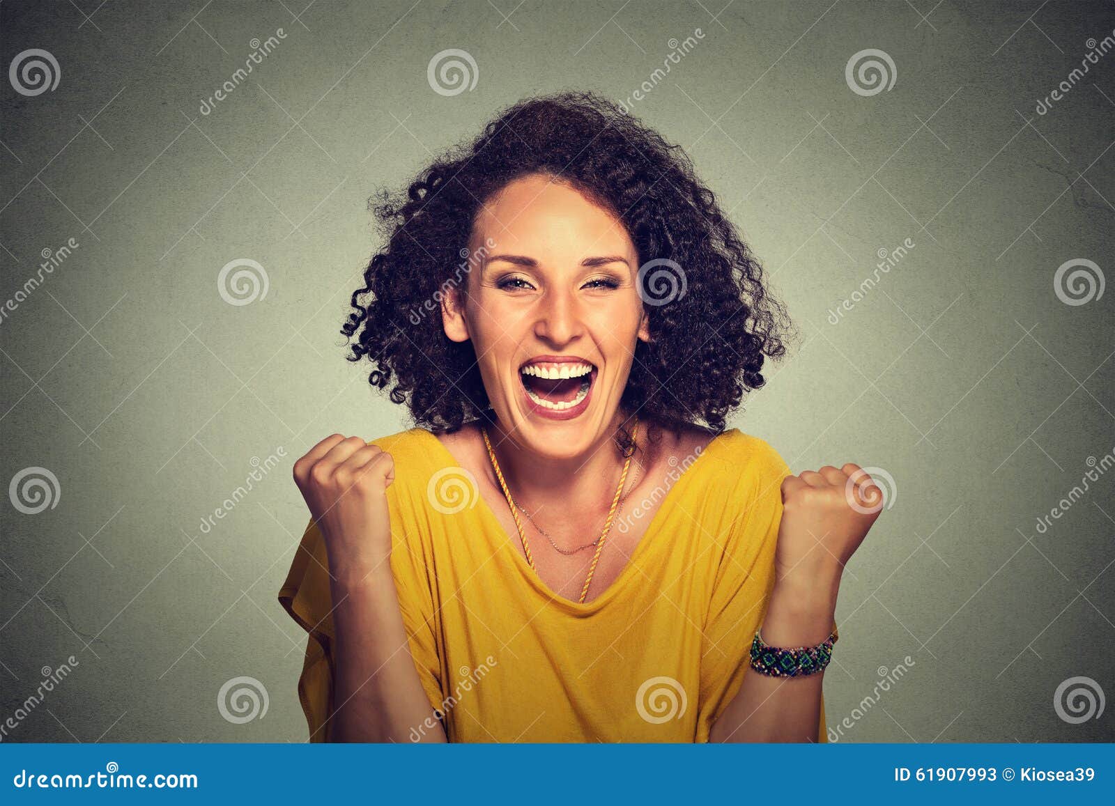 happy woman exults pumping fists ecstatic celebrates success