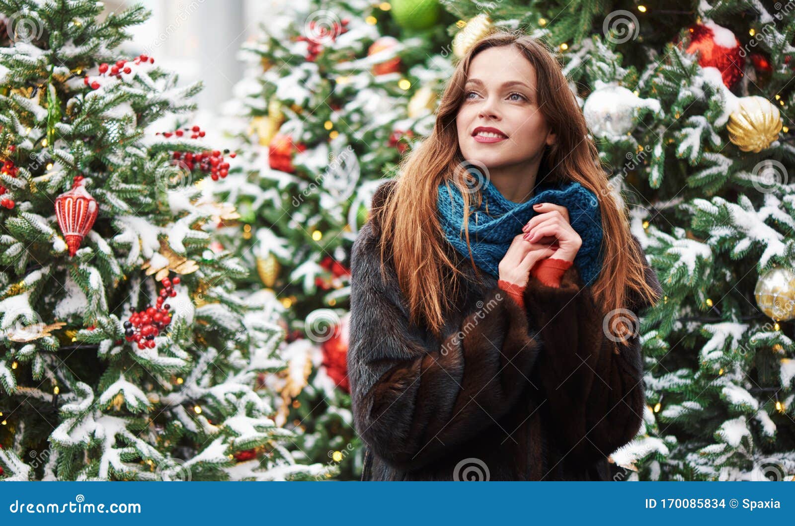 Happy Woman in a Fur Coat Near Christmas Tree Stock Photo - Image of ...