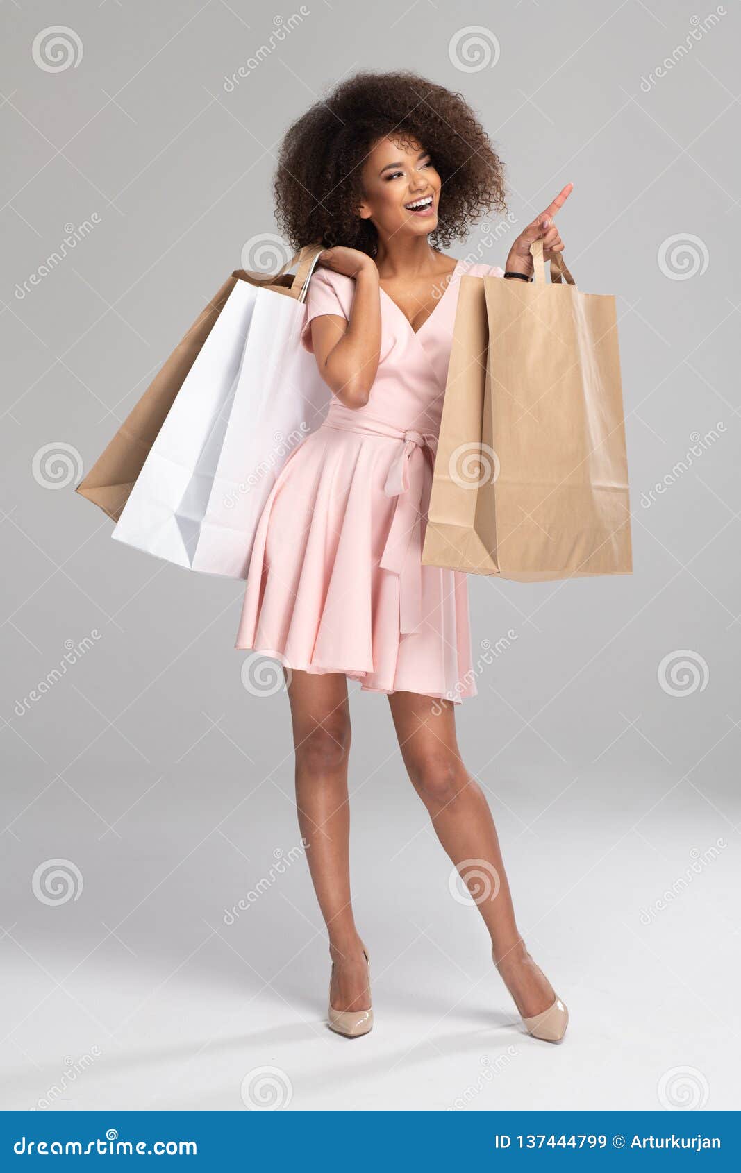 happy woman holding shopping bags