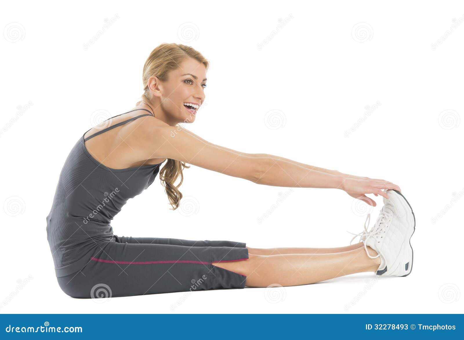 Premium Photo  Closeup of a girl stretching to touch her toes while  sitting on a yoga mat