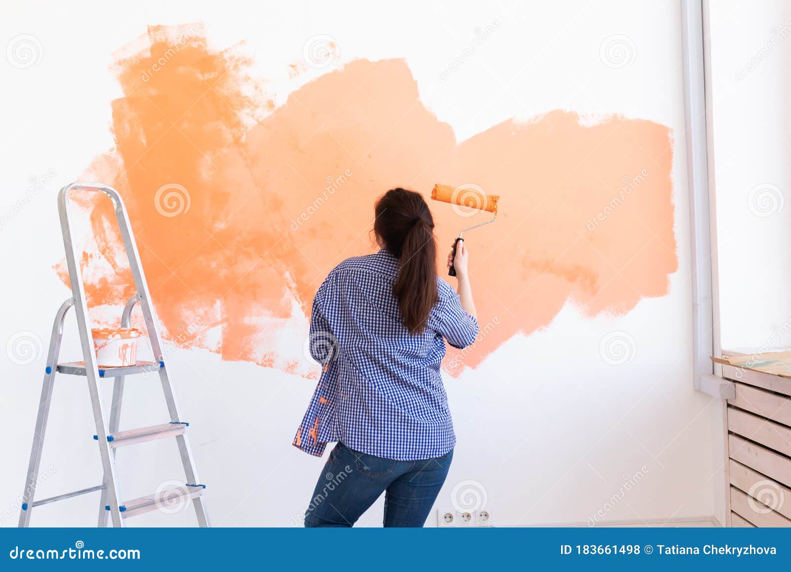 Dancing Funny Woman Painting Interior Wall with Paint Roller in New House.  a Woman with Roller Applying Paint on a Wall. Stock Photo - Image of  designer, redecoration: 183661498
