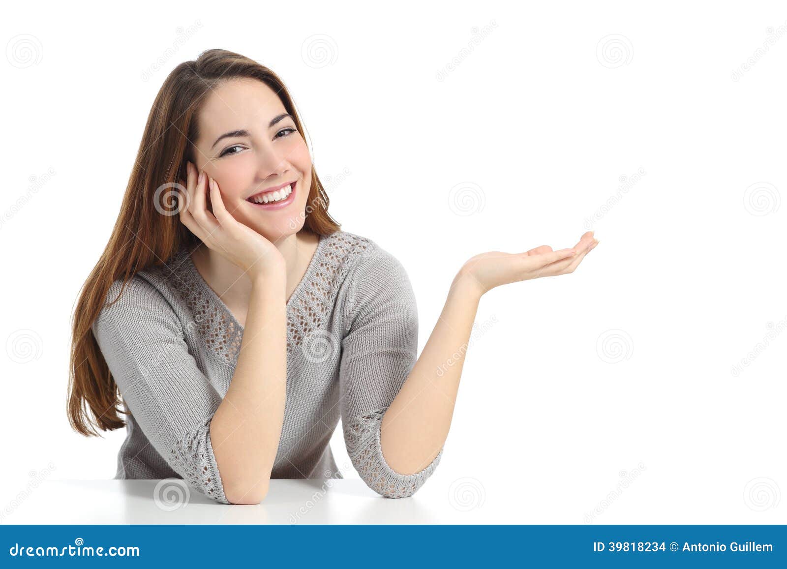 happy woman presenting with open hand holding something blank