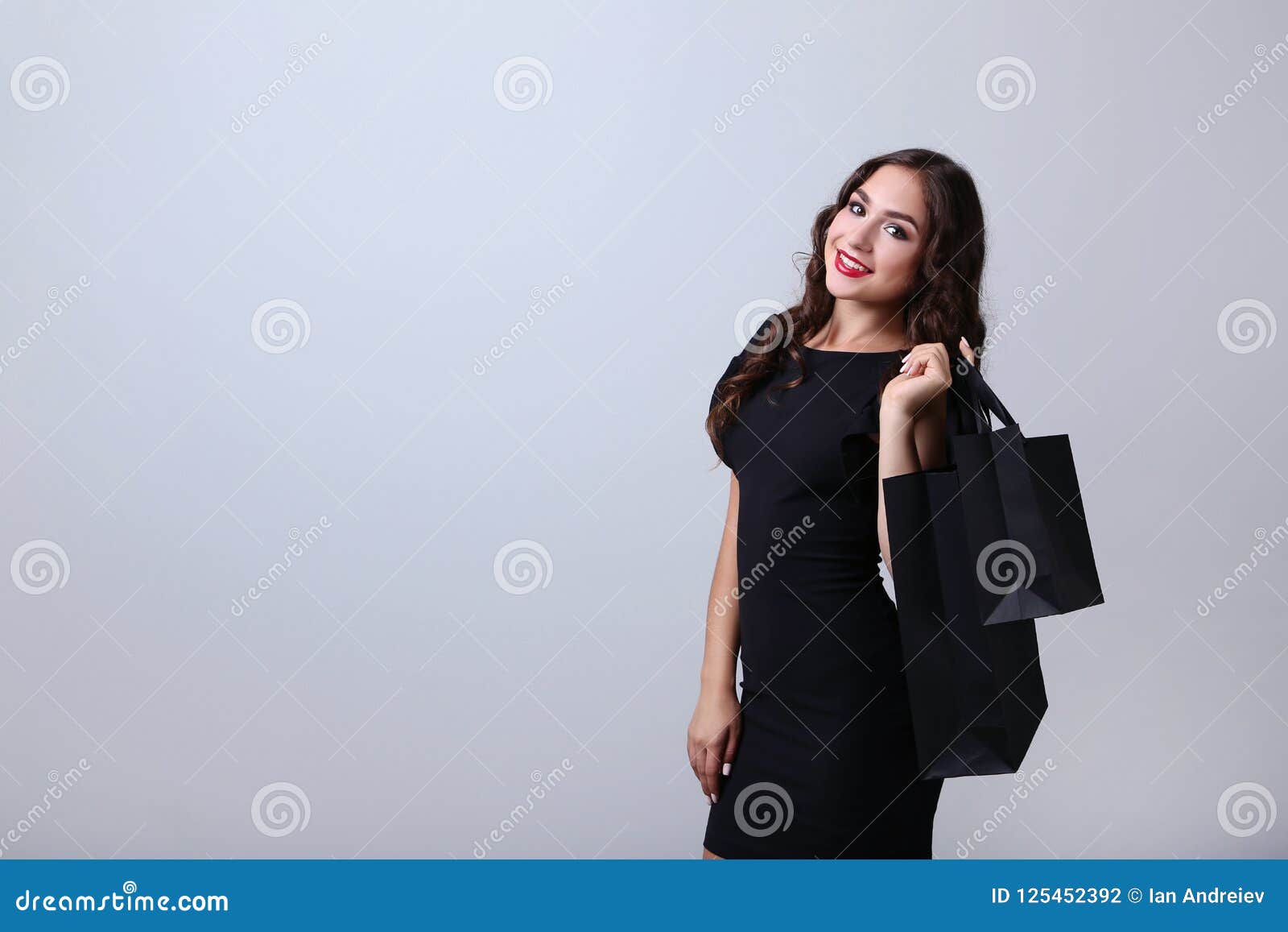 Woman with shopping bags stock photo. Image of joyful - 125452392