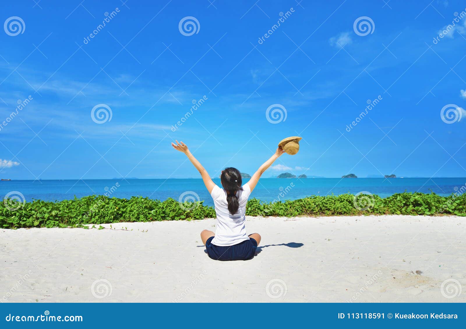 happy woman sitting enjoy life on beach
