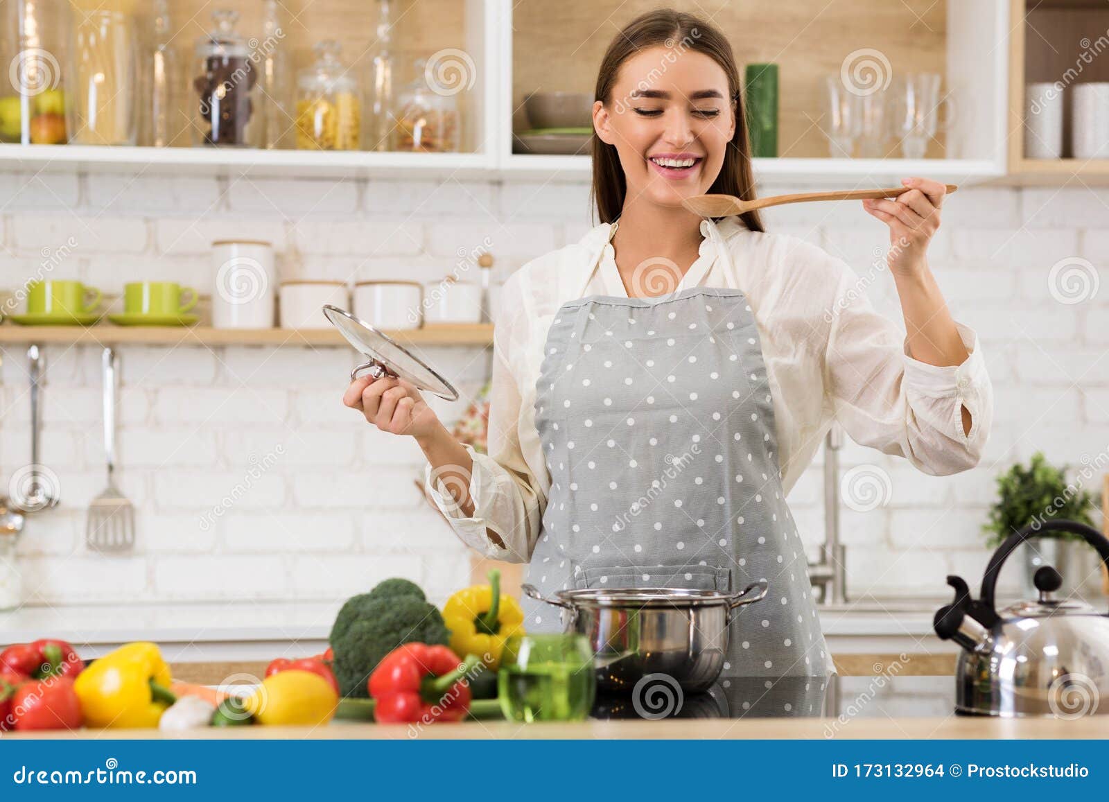 Happy Woman Tasting Soup from Wooden Spoon Stock Photo - Image of alone ...