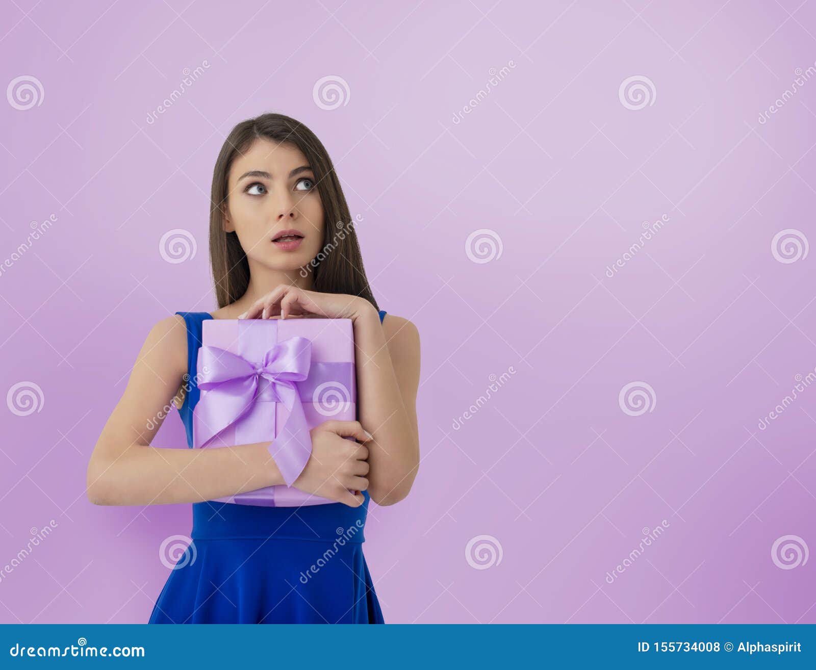 happy woman think about her received present