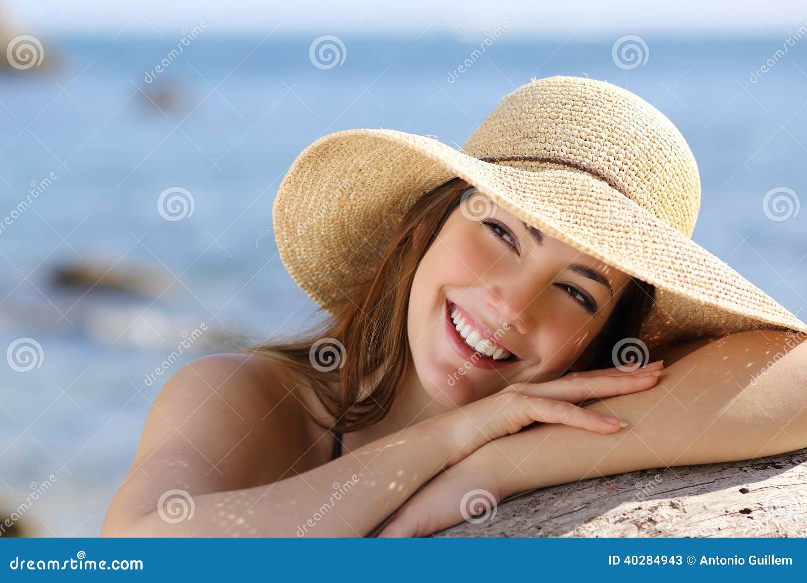 happy woman with white smile looking sideways on vacations