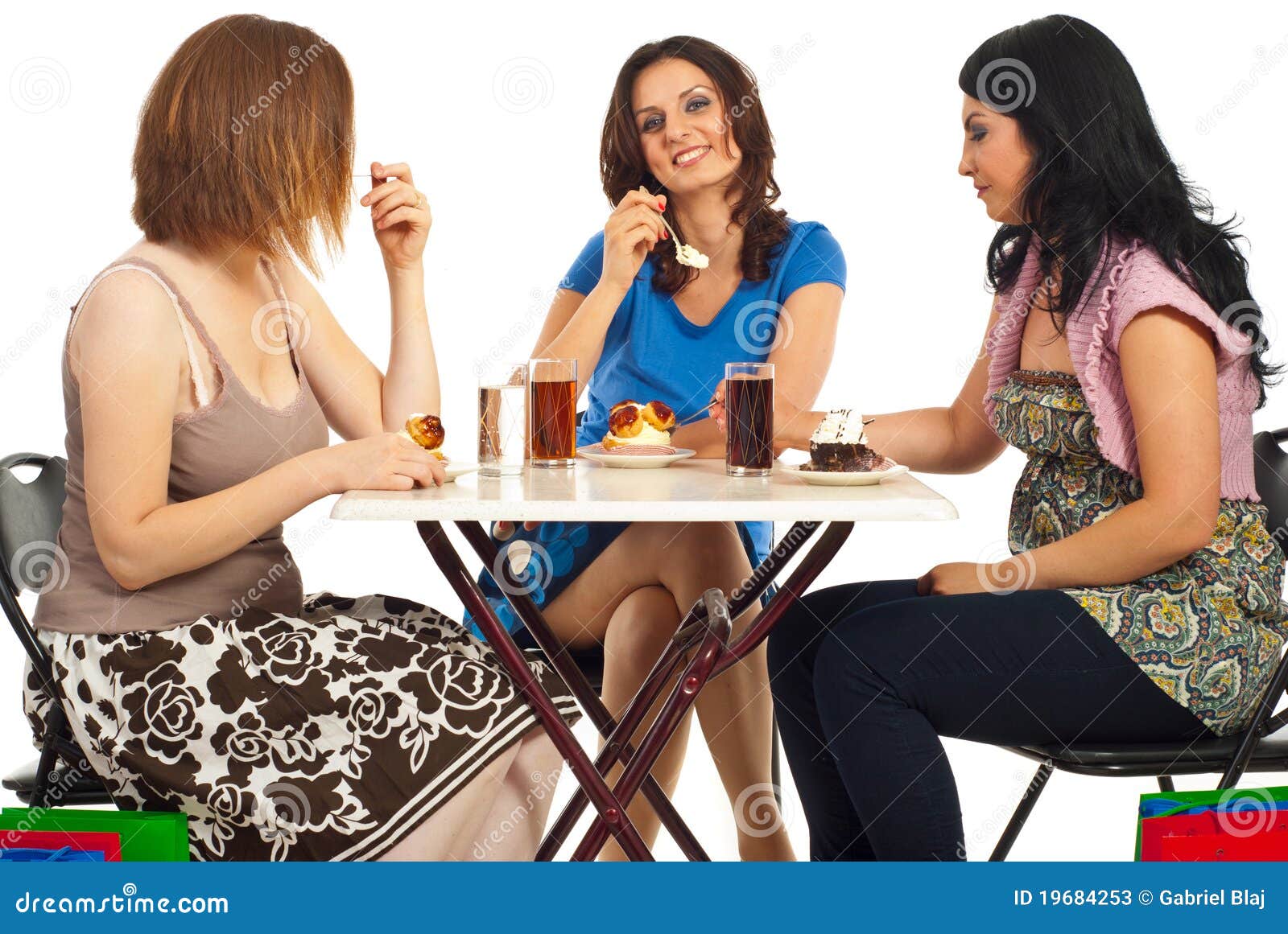 Happy Women Eating Cakes at Table Stock Image Image of drinking