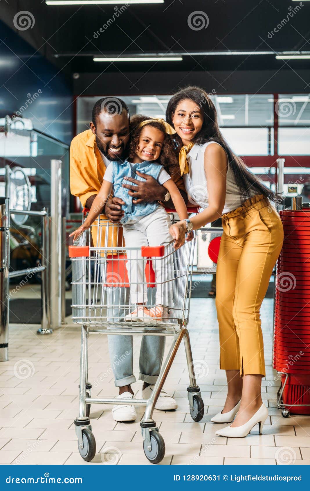 Happy Young African American Couple with Little Daughter Standing in ...