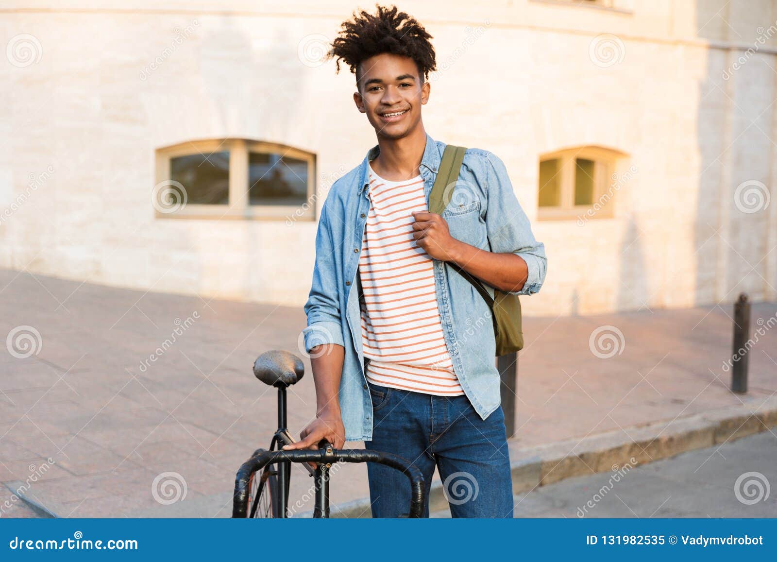 Happy Young African Guy Walking with Bicycle Outdoors on the Street ...