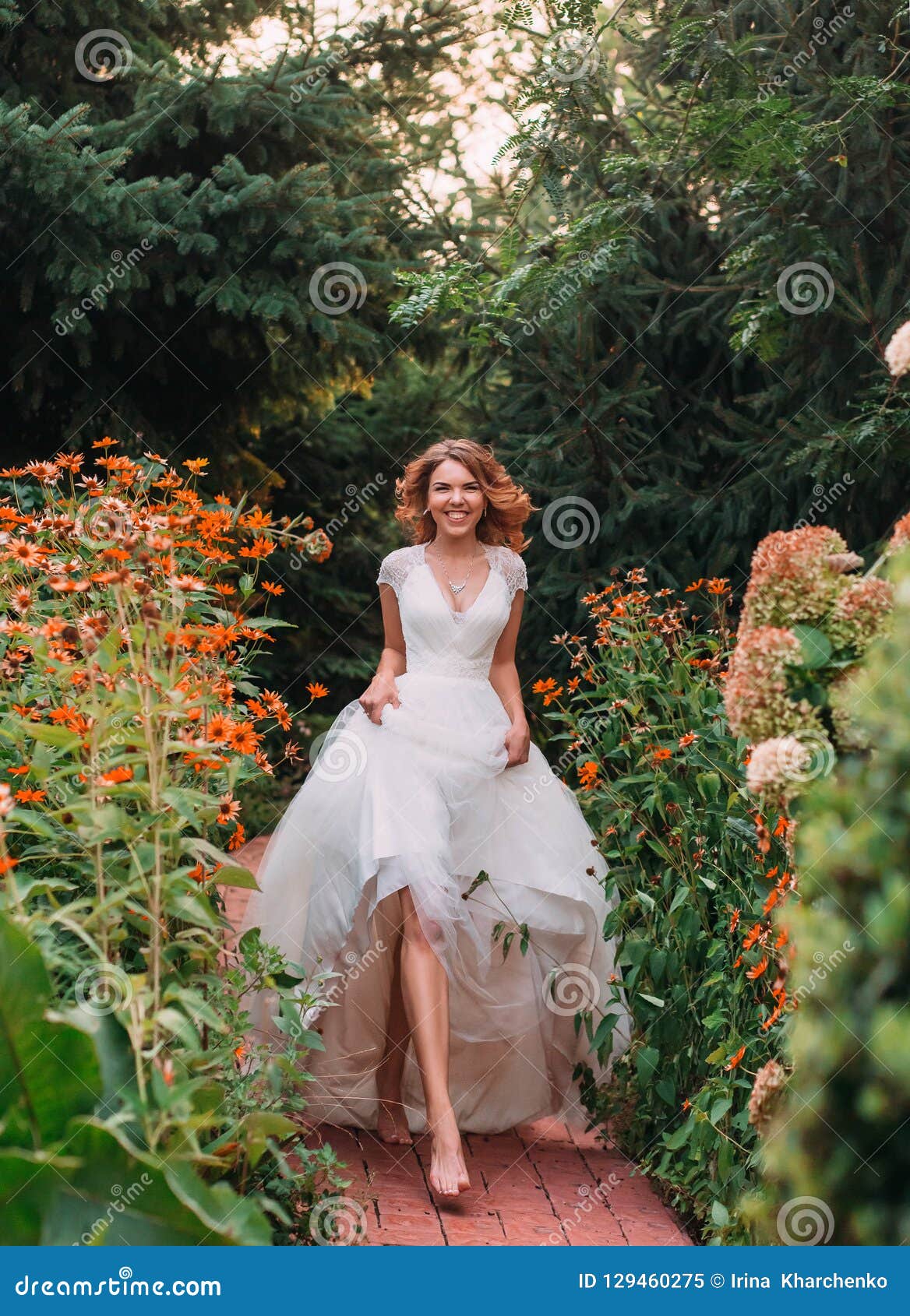 https://thumbs.dreamstime.com/z/happy-young-blonde-girl-elegant-amazing-long-white-wedding-light-dress-long-train-walking-wonderful-happy-young-129460275.jpg