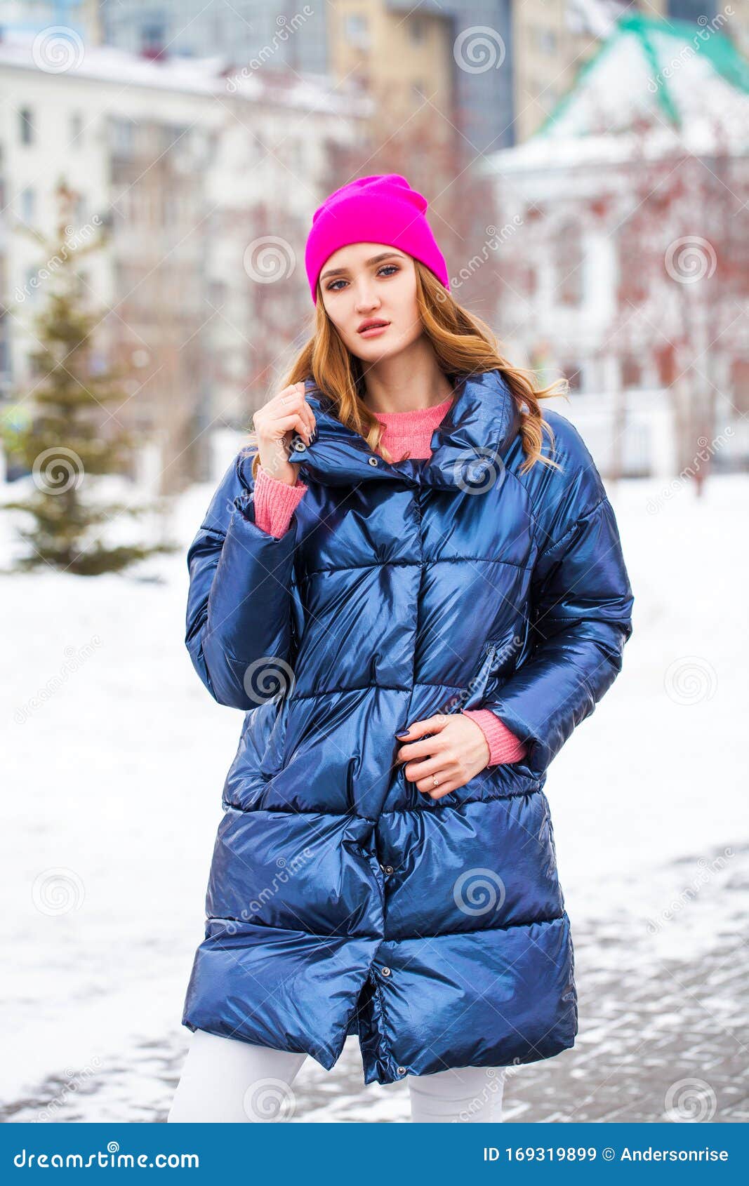 Young Blonde Woman in Blue Down Jacket in Winter Street Stock Image ...