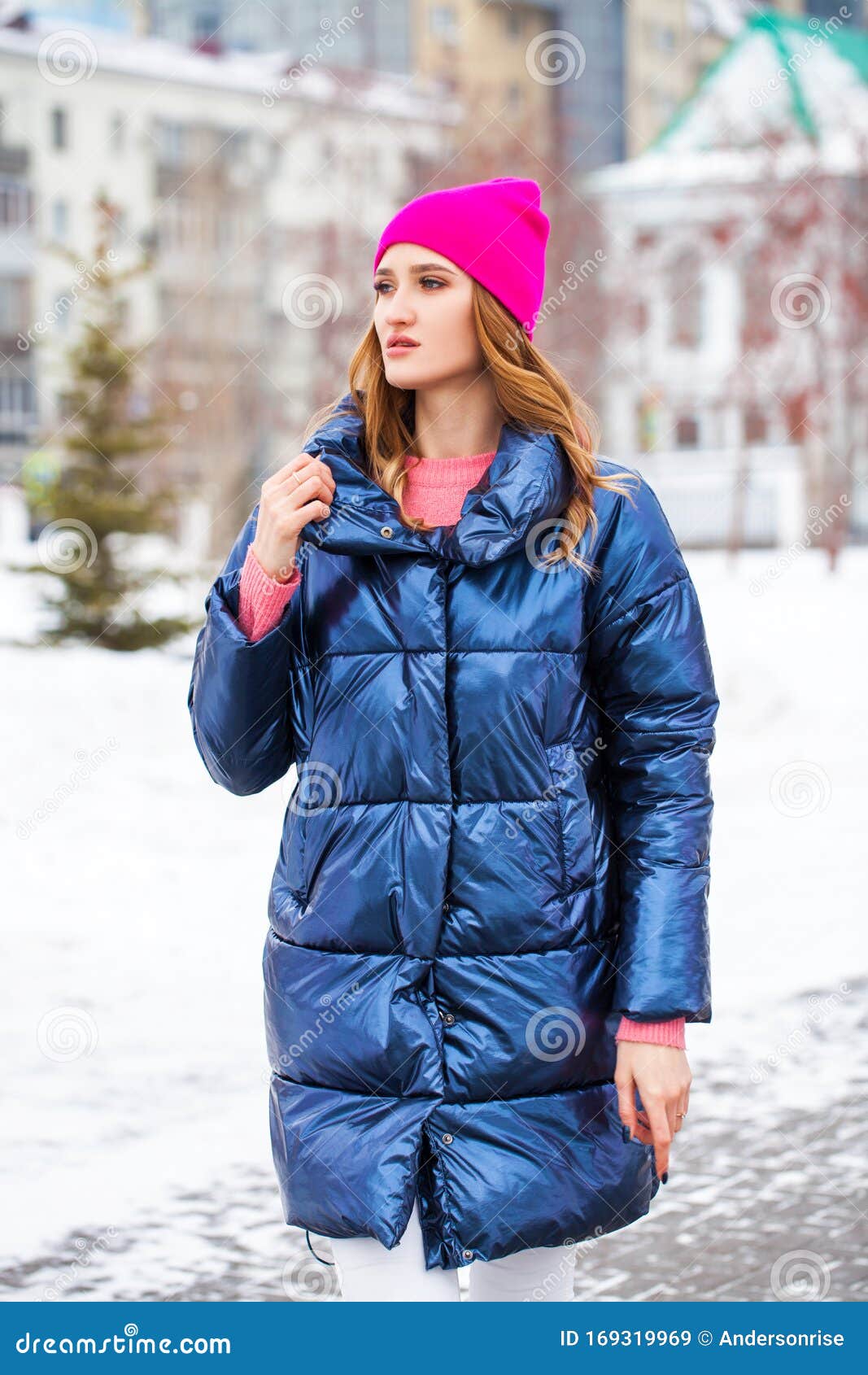 Young Blonde Woman in Blue Down Jacket in Winter Street Stock Image ...