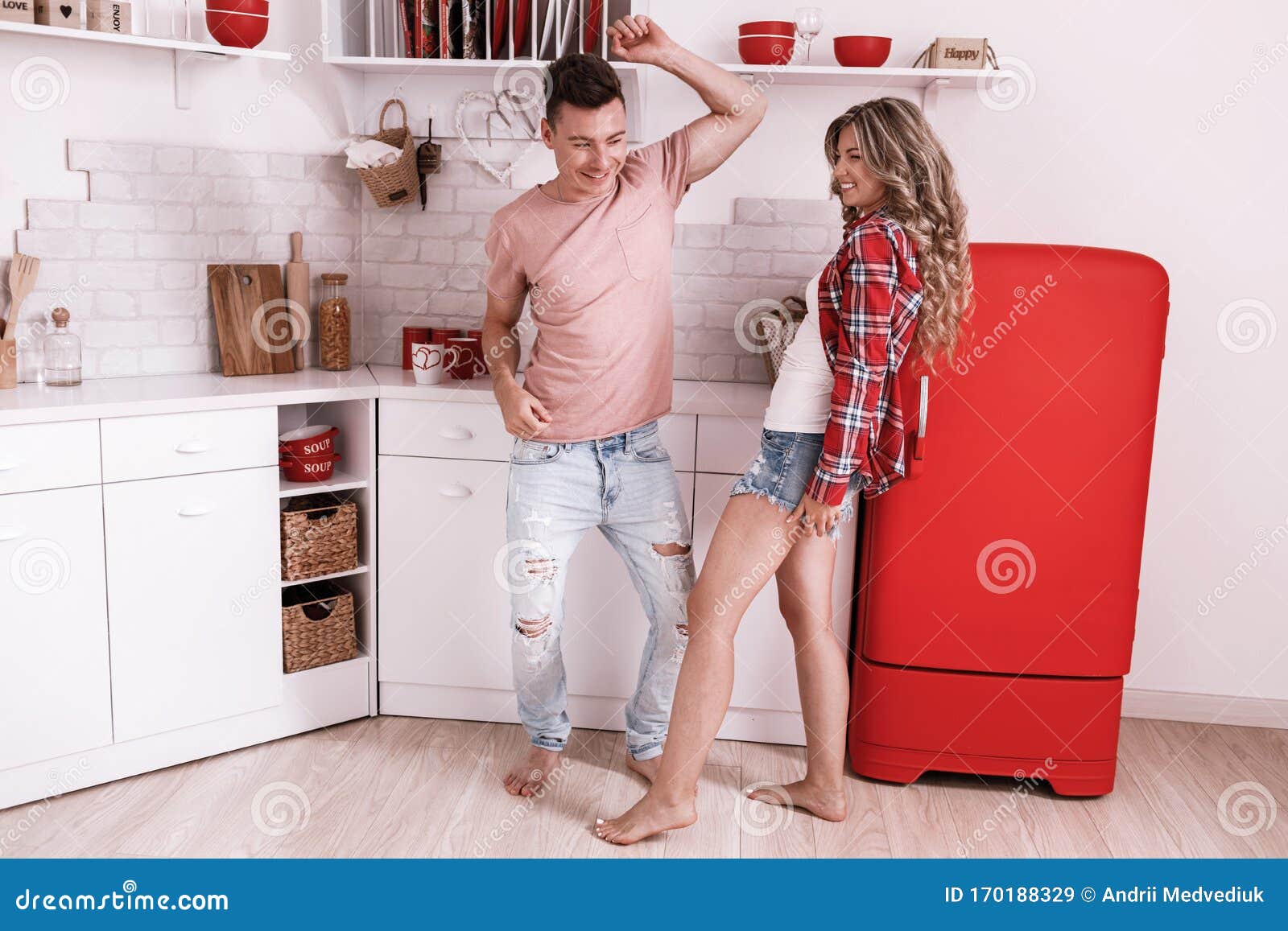 Happy Young Couple in Love are Dancing in the Kitchen on Valentine ...