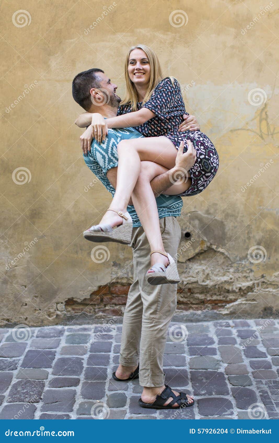 https://thumbs.dreamstime.com/z/happy-young-couple-man-holding-woman-his-arms-love-men-women-57926204.jpg