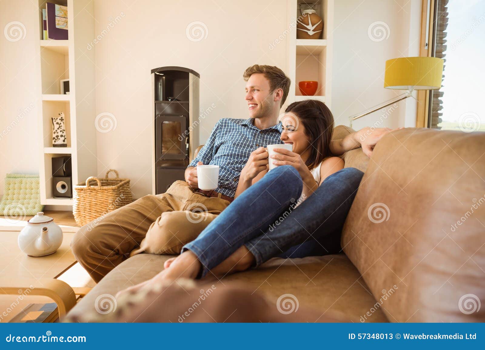 happy young couple relaxing on the couch