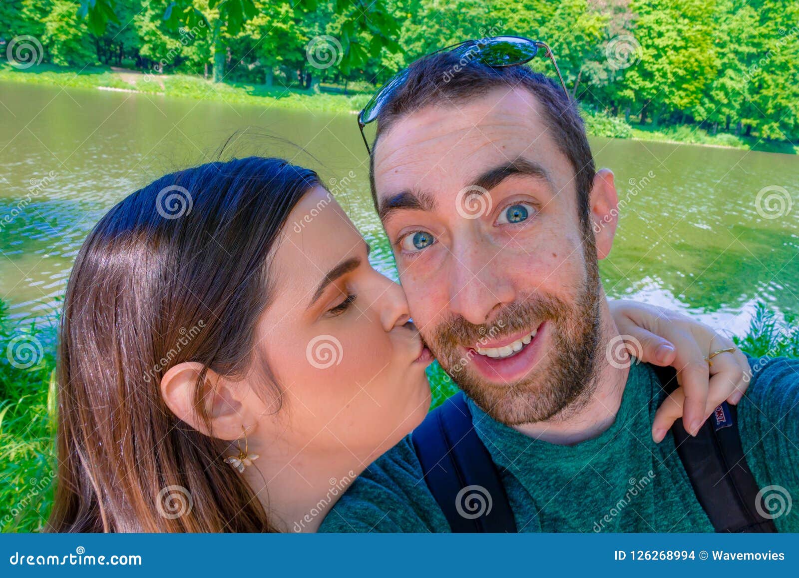 Happy Young Couple Taking A Selfie With Smartphone Or Camera At Stock