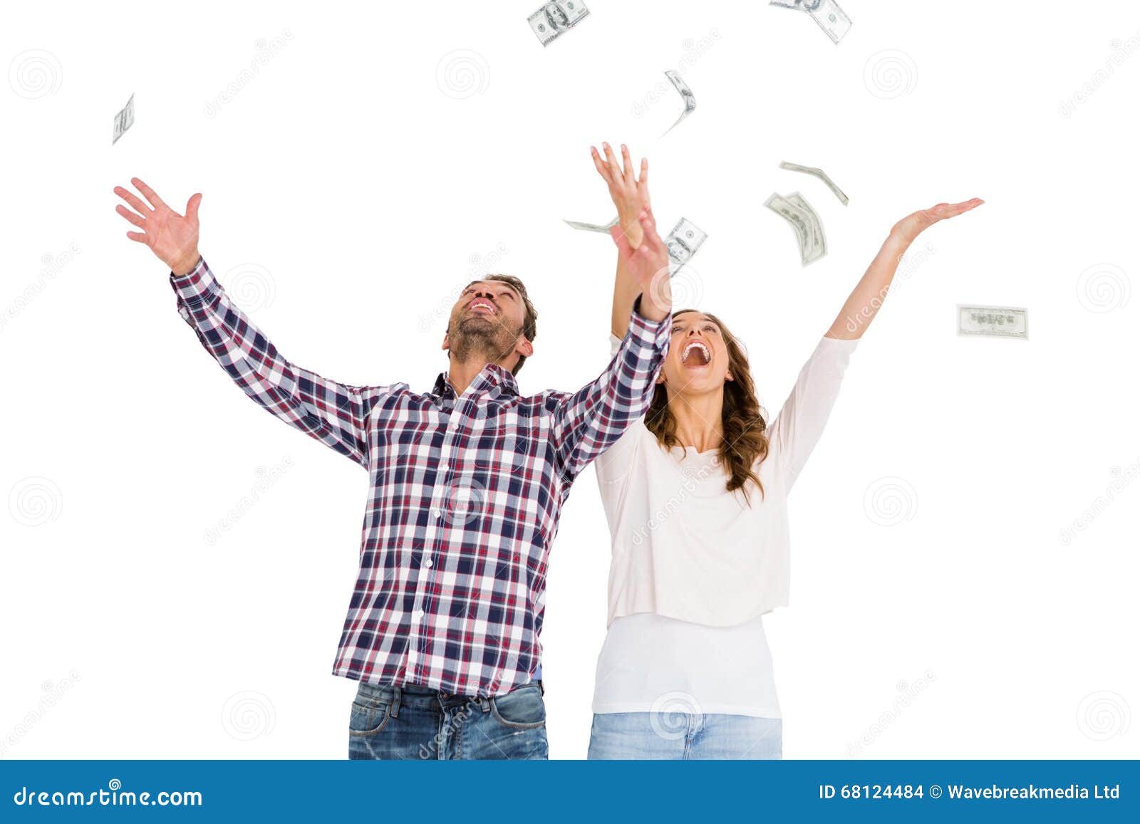happy young couple throwing currency notes in air