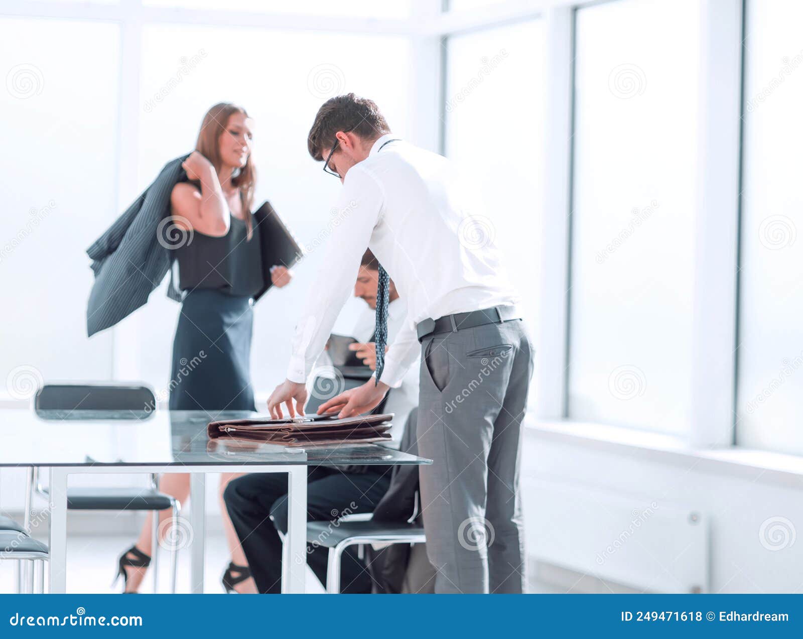 Happy Young Employees at the End of the Working Day in the Office Stock