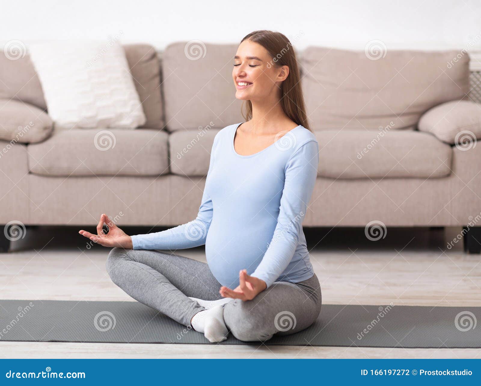 Happy Young Expectant Meditating On The Floor Stock Photo Image