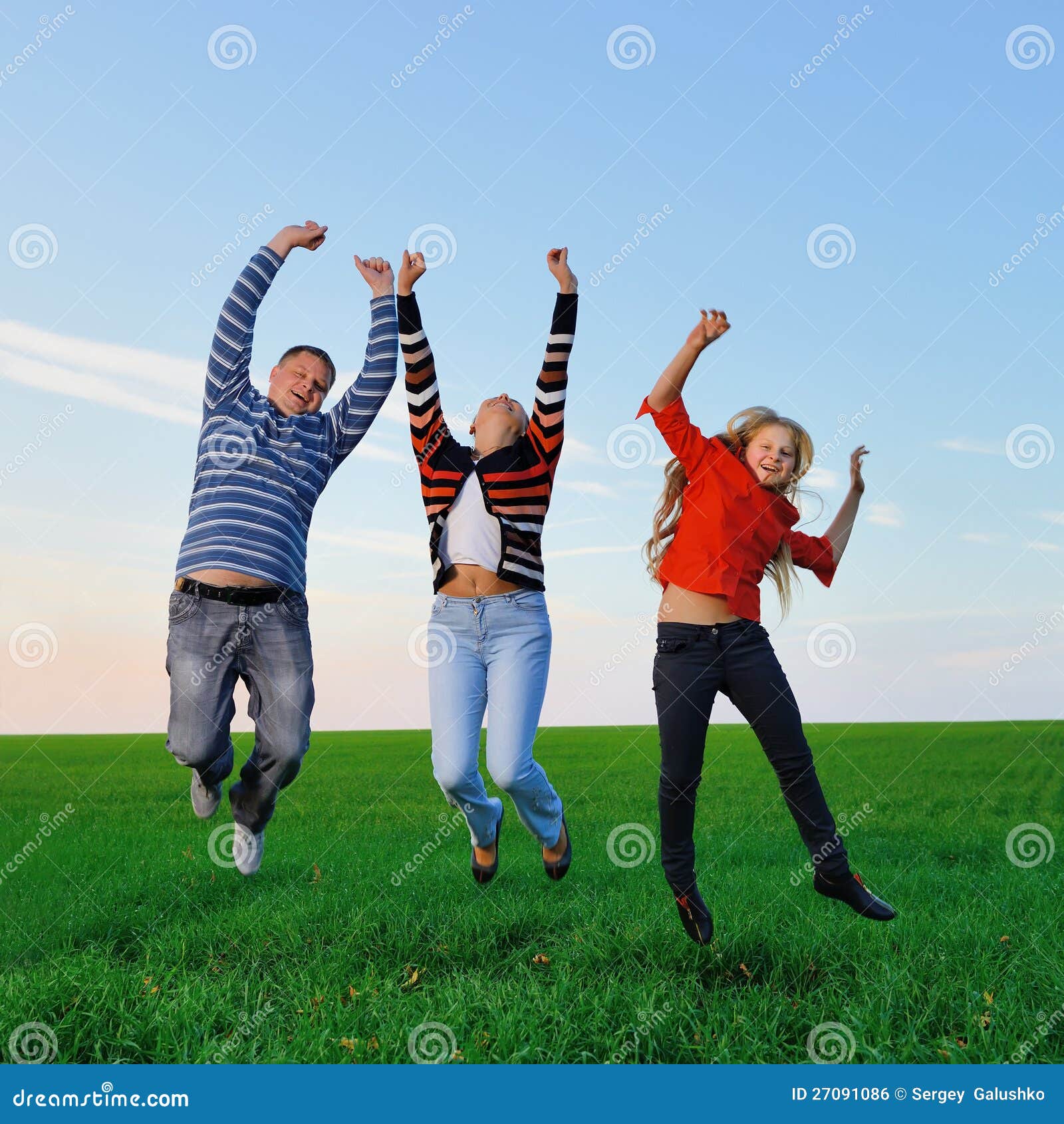 happy young family jump for joy