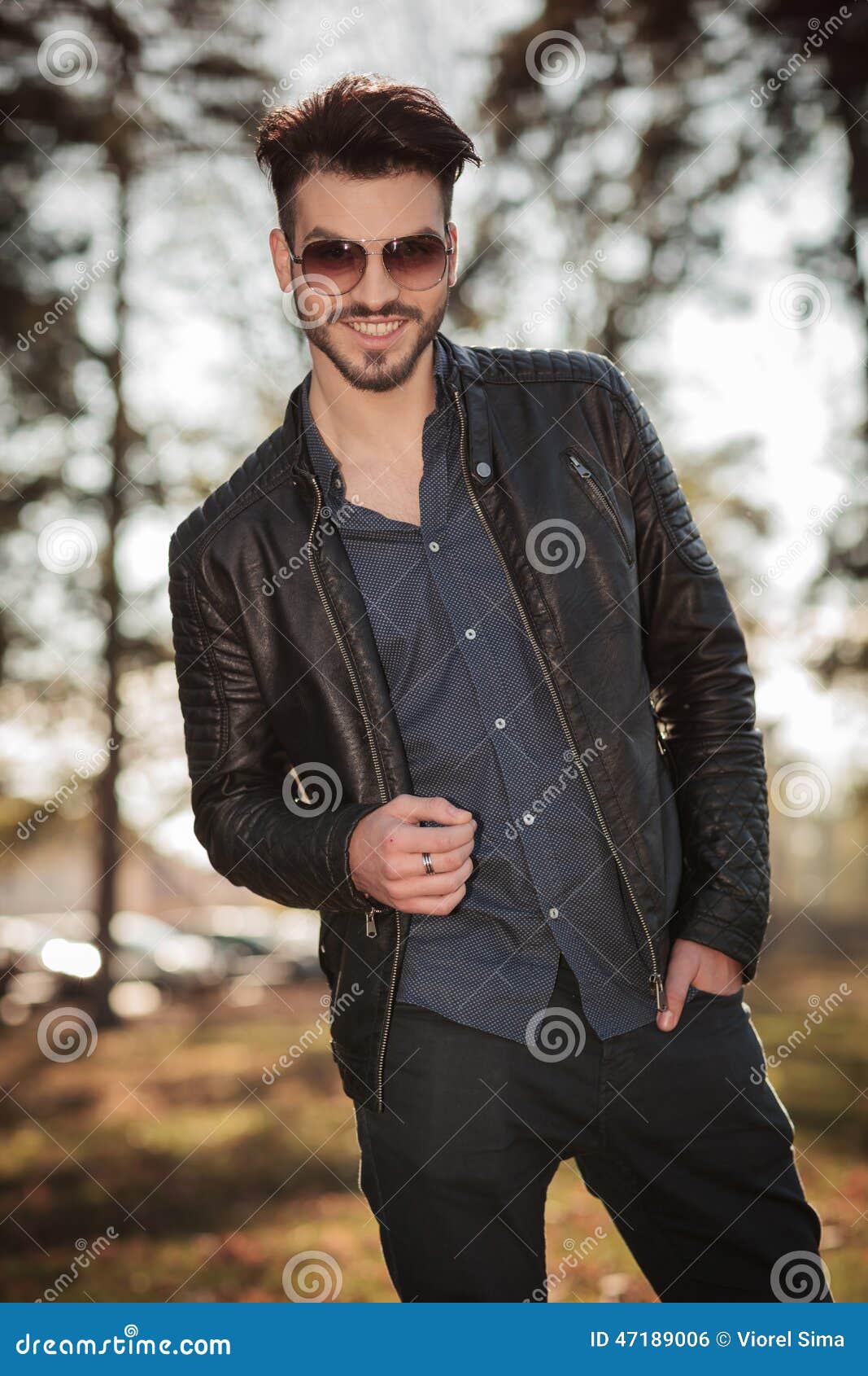 Happy Young Fashion Man Posing in the Park Stock Photo - Image of ...