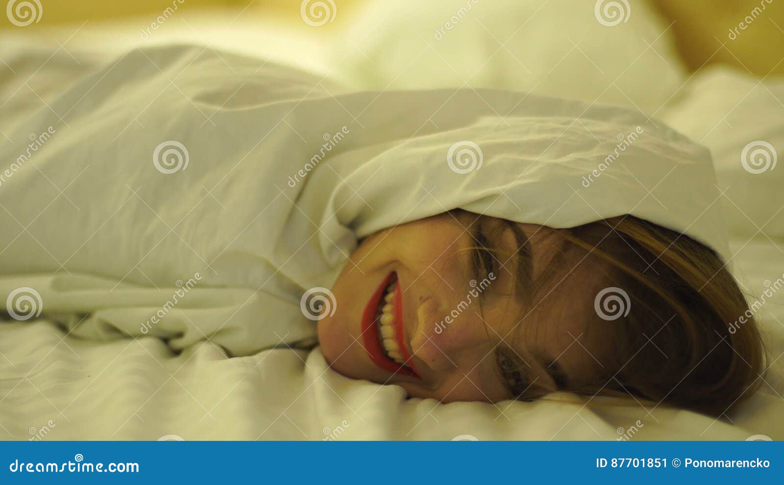 Happy Young Girl with Red Lips in a White Blanket Stock Video Video