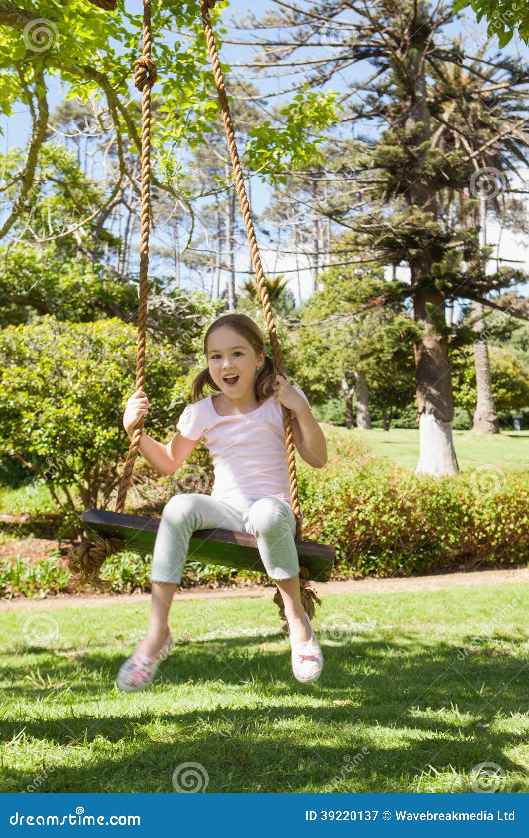 Happy Young Girl Sitting On Swing At Park Stock Image Image Of 