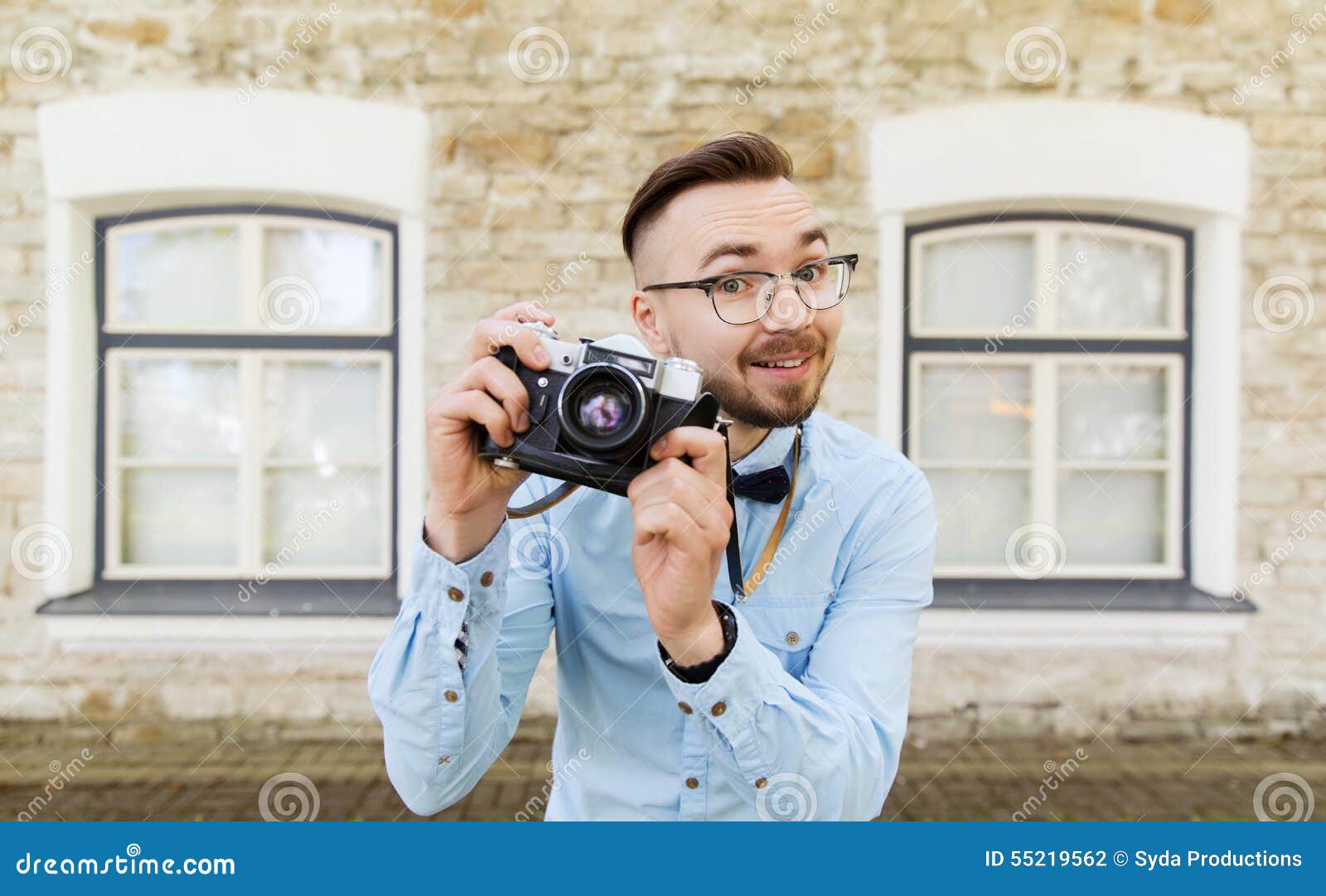 Happy Young Hipster Man With Film 